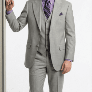 Man in gray three-piece suit and purple shirt