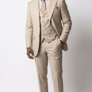 Person wearing beige three-piece suit and tie